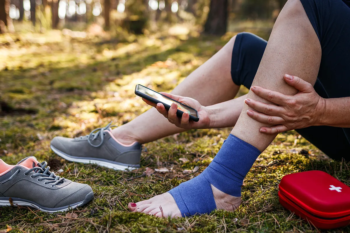 person with wrapped ankle using Slocum virtual care platform powered by ortholive