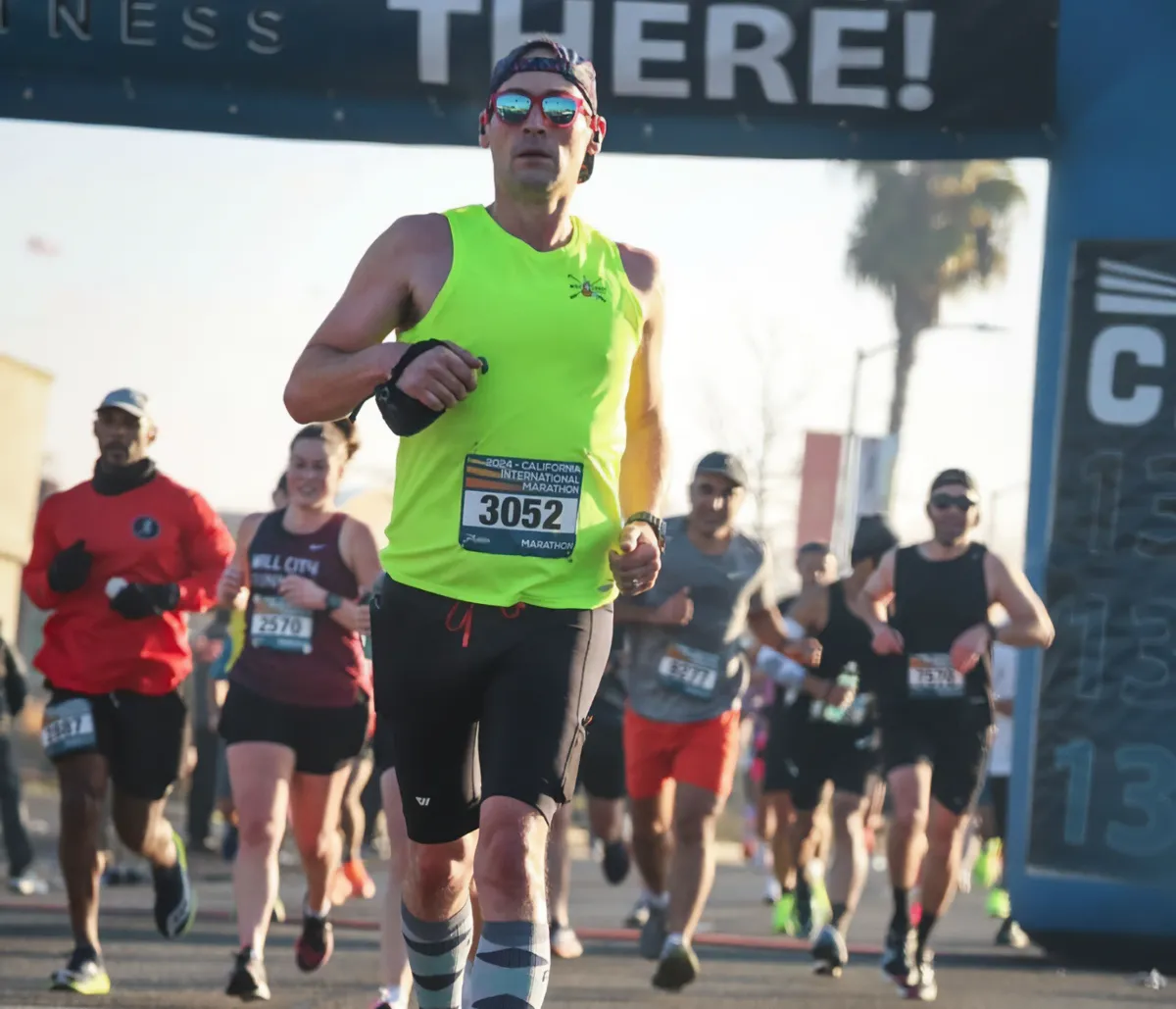 A man running in a marathon after ACL surgery at Slocum Orthopedics